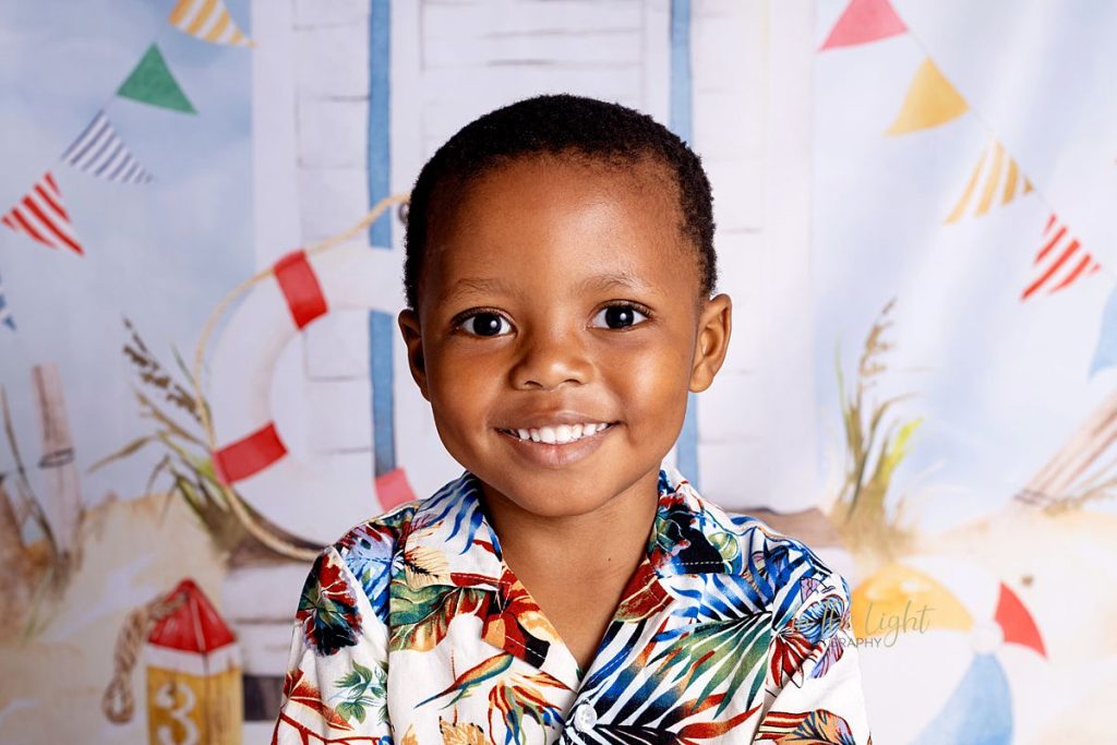 Young boy smiling at his pre school photo day