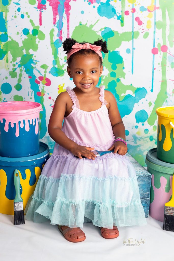 Preschool photo of a girl smiling happily during their annual nursery school photo day in Centurion