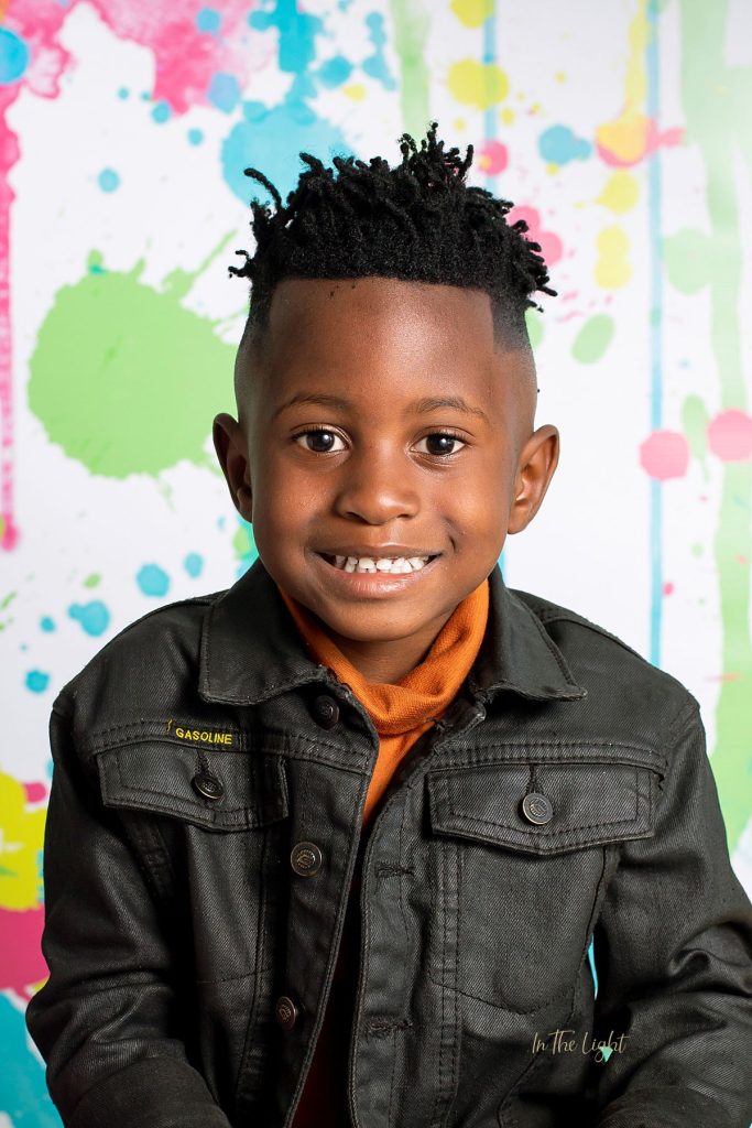 Preschool photo of a boy smiling at their annual school photo day in Sandton
